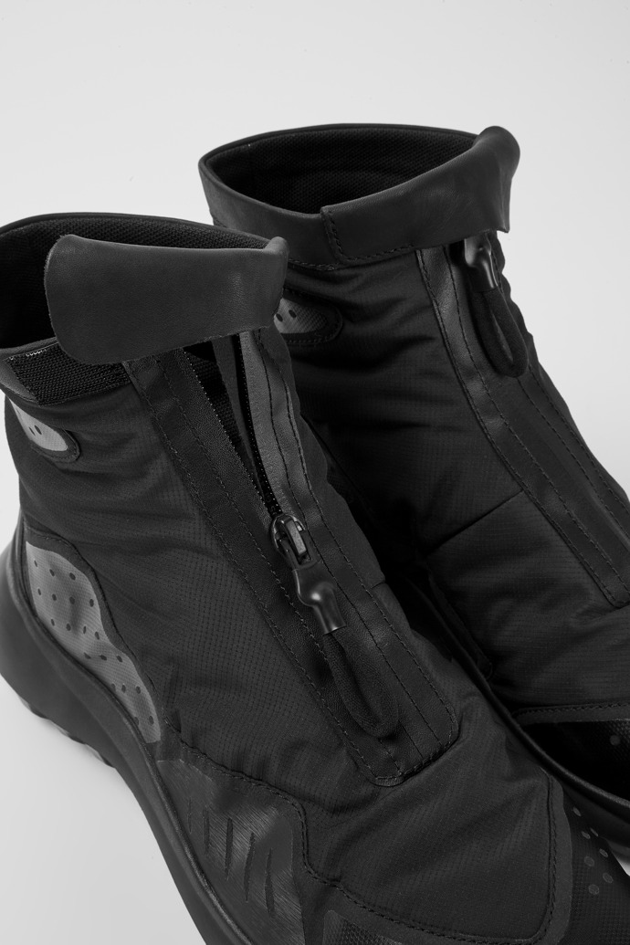 Close-up view of CRCLR Breathable men's black textile ankle boots