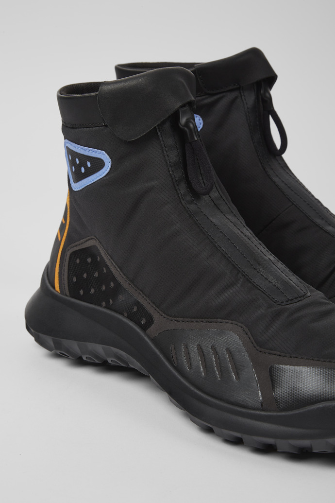 Close-up view of CRCLR Men's black ankle boots with ePE membrane