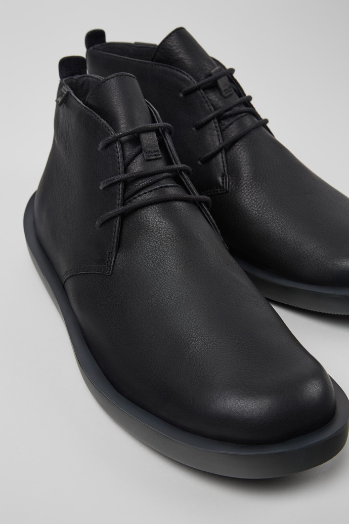 Close-up view of Wagon Black Leather Ankle Boots for Men.