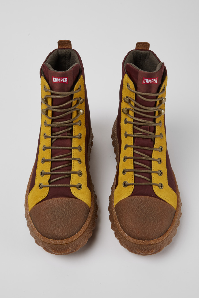 Overhead view of Ground Burgundy and yellow ankle boots
