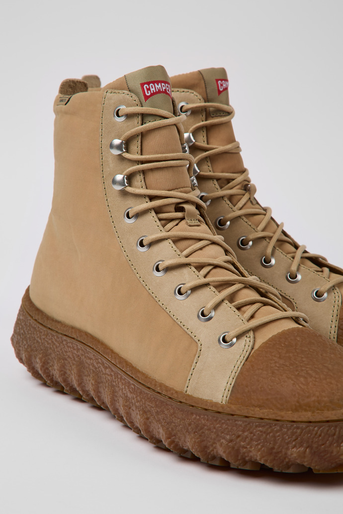 Close-up view of Ground Beige textile and leather ankle boots for men