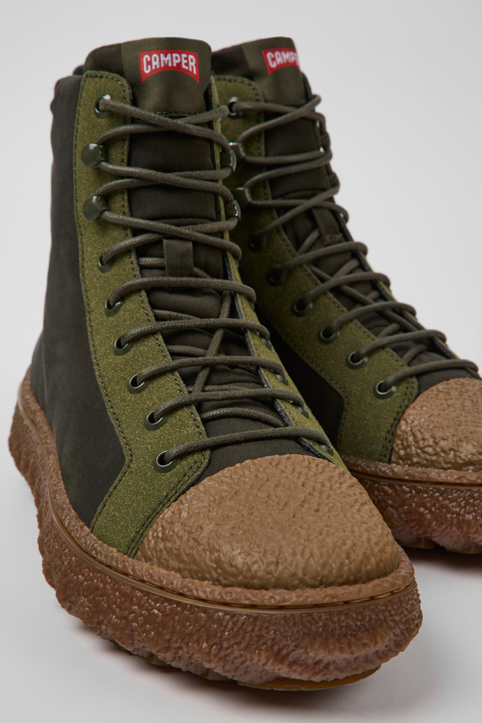 Close-up view of Ground PrimaLoft® Green-gray textile and leather ankle boots for men