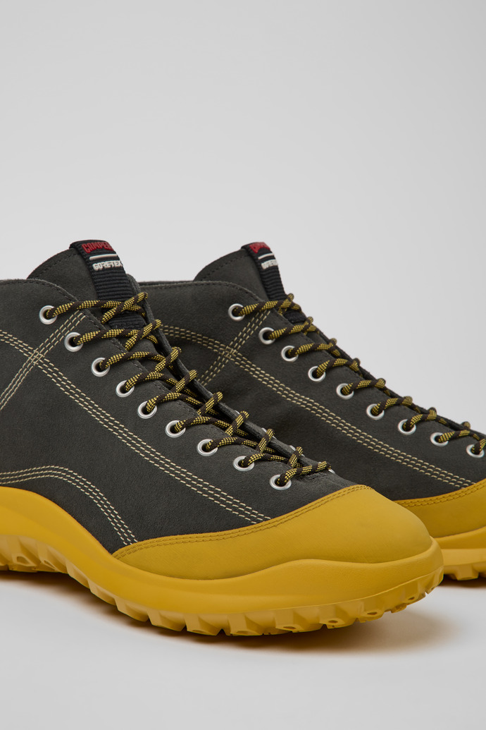 Close-up view of CRCLR Gray and yellow nubuck ankle boots for men
