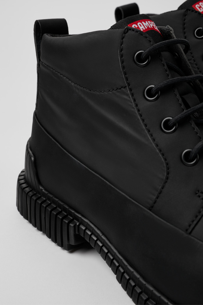 Close-up view of Pix Black recycled leather lace-up boots for men
