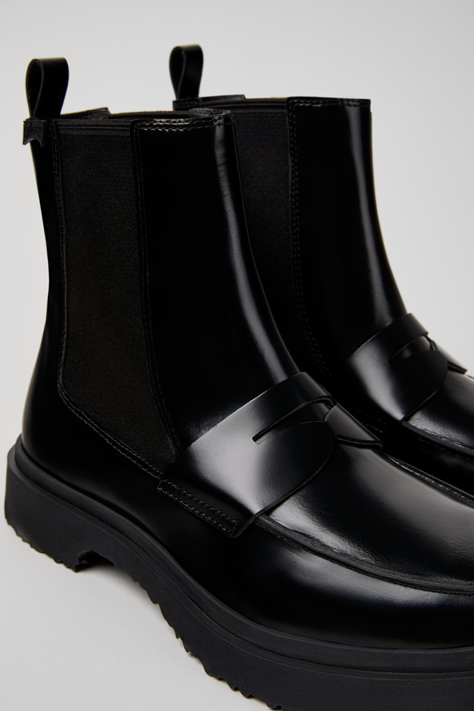 Close-up view of Walden Black Leather Mid Boots for Men.