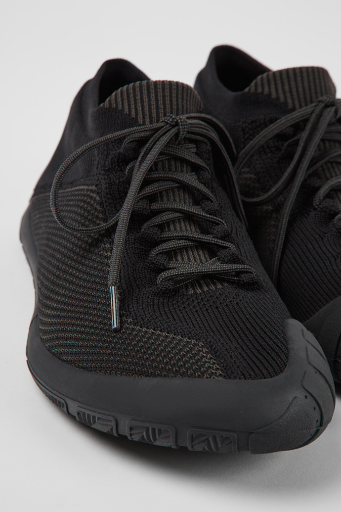 Close-up view of Path Black textile sneakers for men
