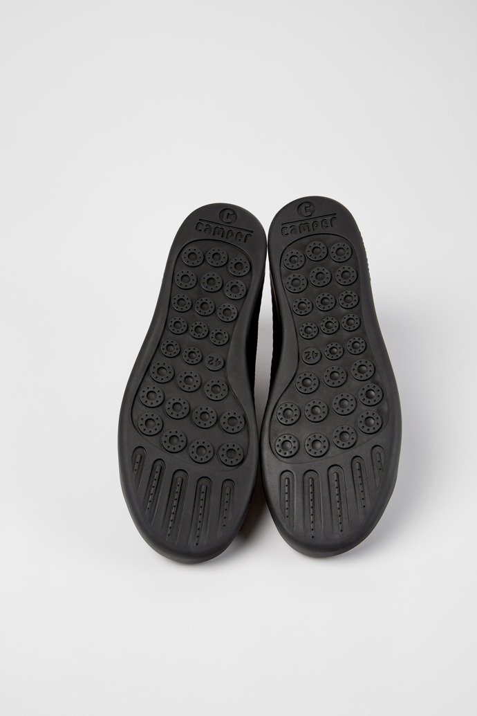 The soles of Peu Touring Black one-piece knit sneakers for men
