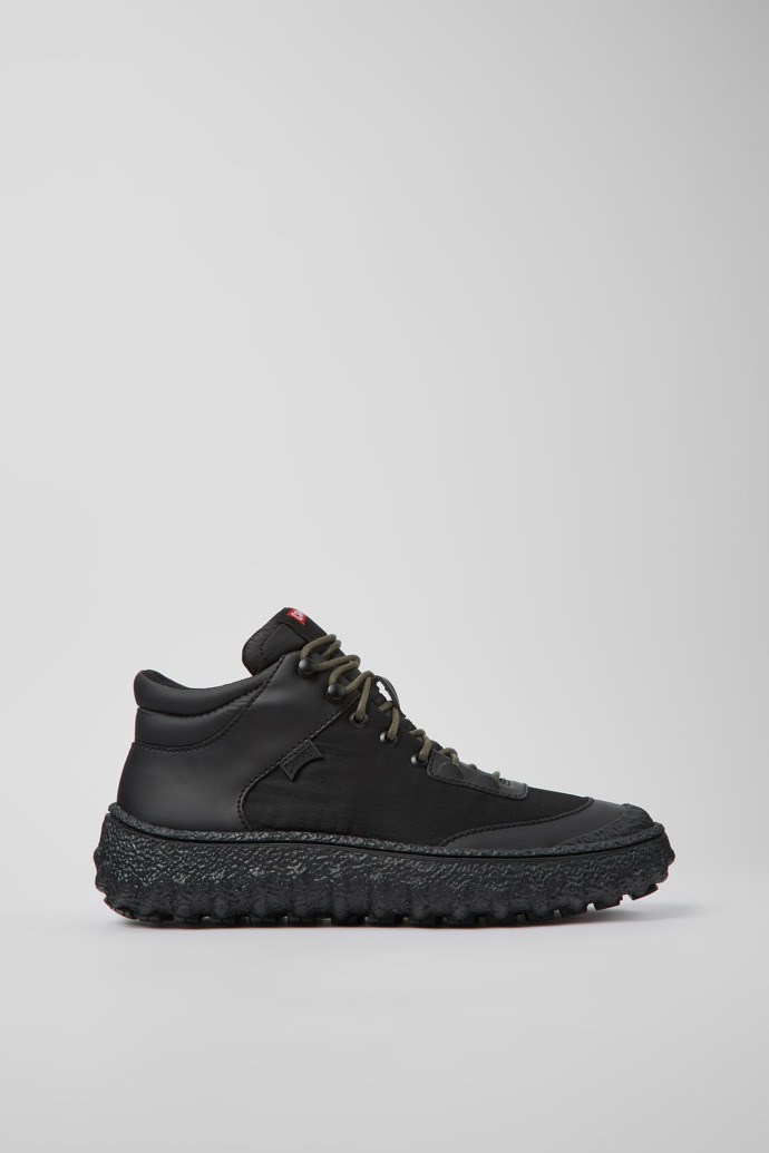 Image of Side view of Ground Black textile and leather shoes for men