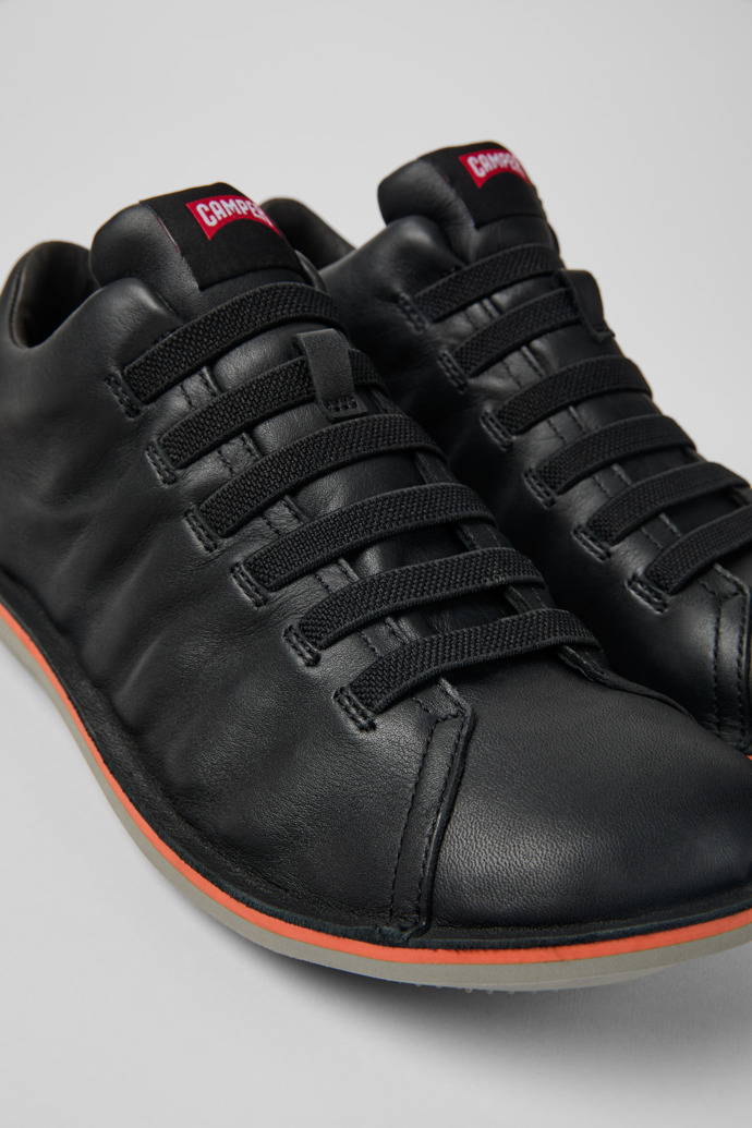 Close-up view of Beetle Black leather sneakers