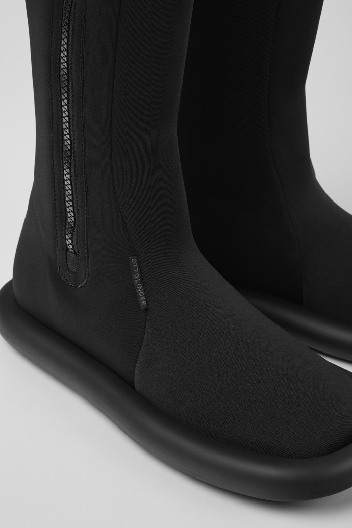 Close-up view of Ottolinger Black boots for men by Camper x Ottolinger
