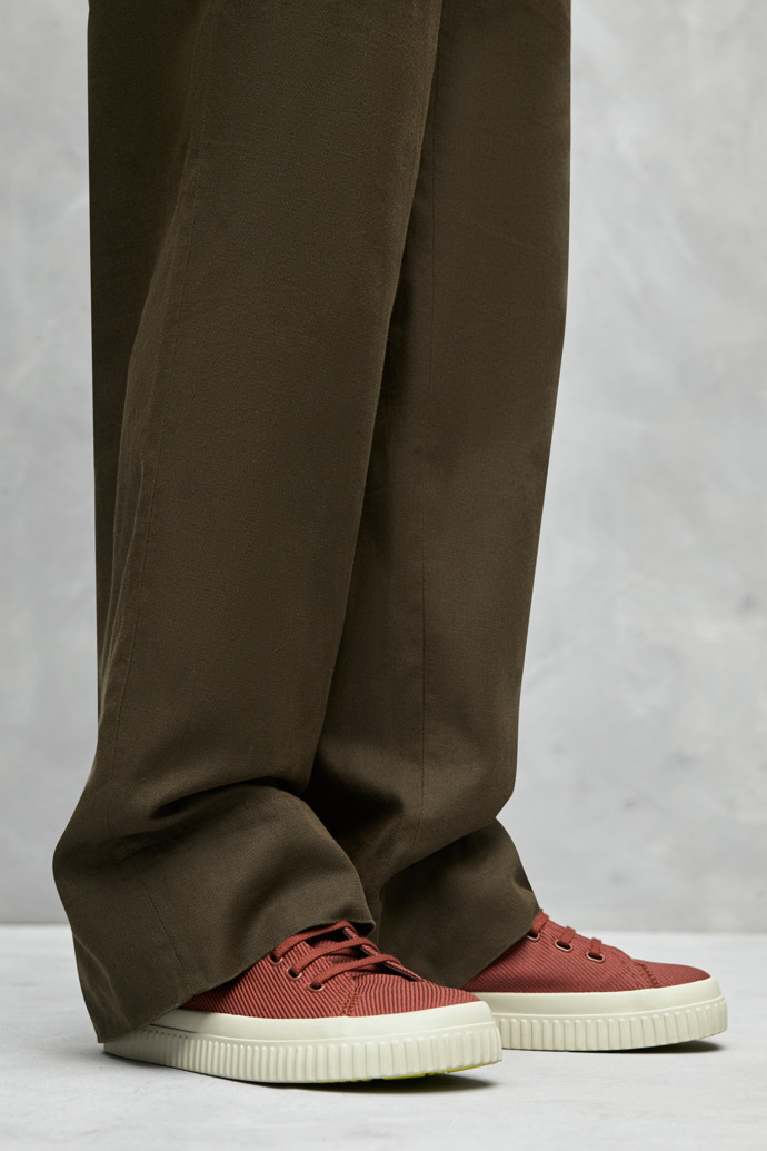 A model wearing Peu Roda Red recycled cotton sneakers for men