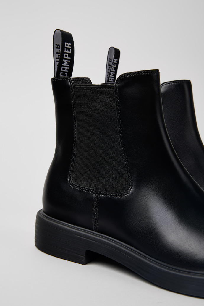 Close-up view of Dean Black leather ankle boots for men