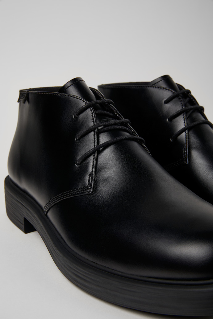 Close-up view of Dean Black leather ankle boots for men