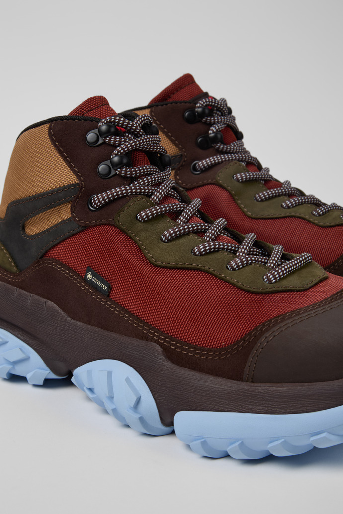 Close-up view of Karst Trek Brown and red ankle boots for men