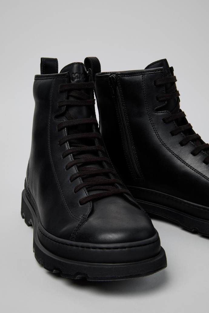 Close-up view of Brutus+ Black Leather Mid Boots for Men.