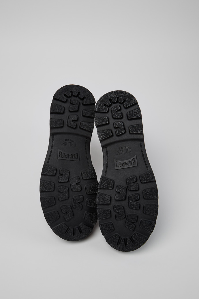 The soles of Brutus+ Black Leather Mid Boots for Men.