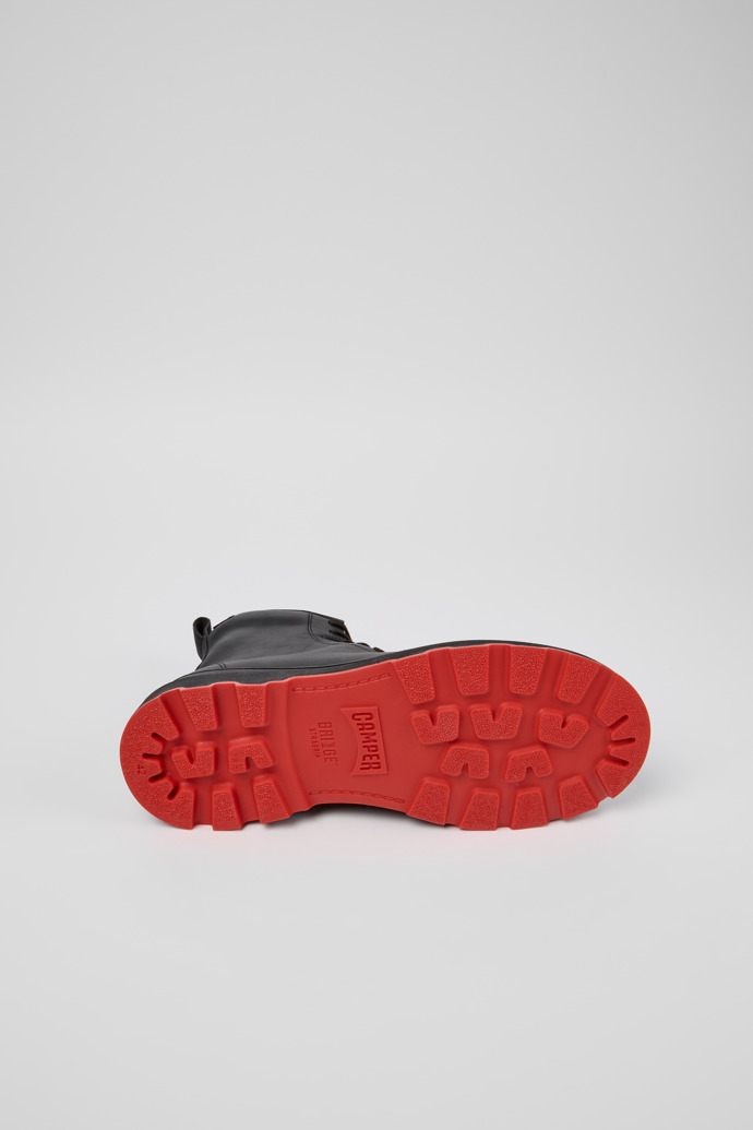 The soles of Brutus+ HYDROSHIELD Black Leather Mid Boots for Men.