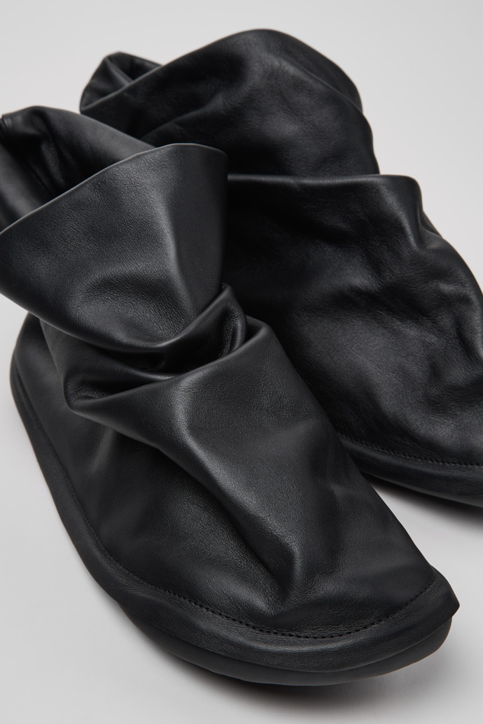 Close-up view of Camper x ISSEY MIYAKE - Peu Form Black Leather Ankle Boots for Men.