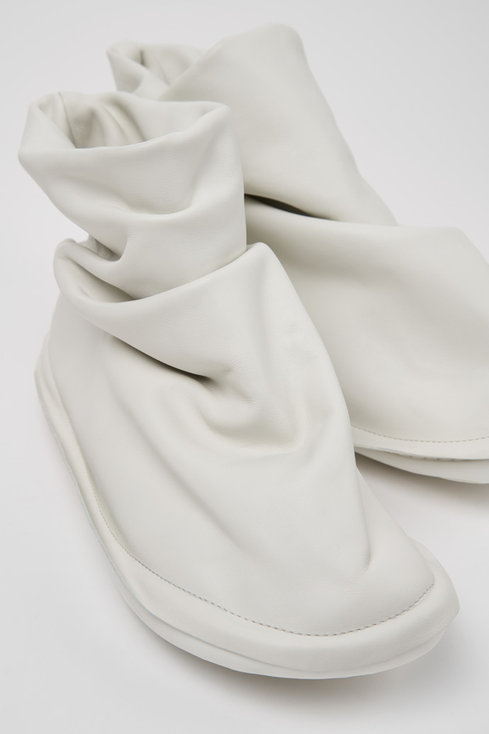 Close-up view of Camper x ISSEY MIYAKE - Peu Form White Leather Ankle Boots for Men.