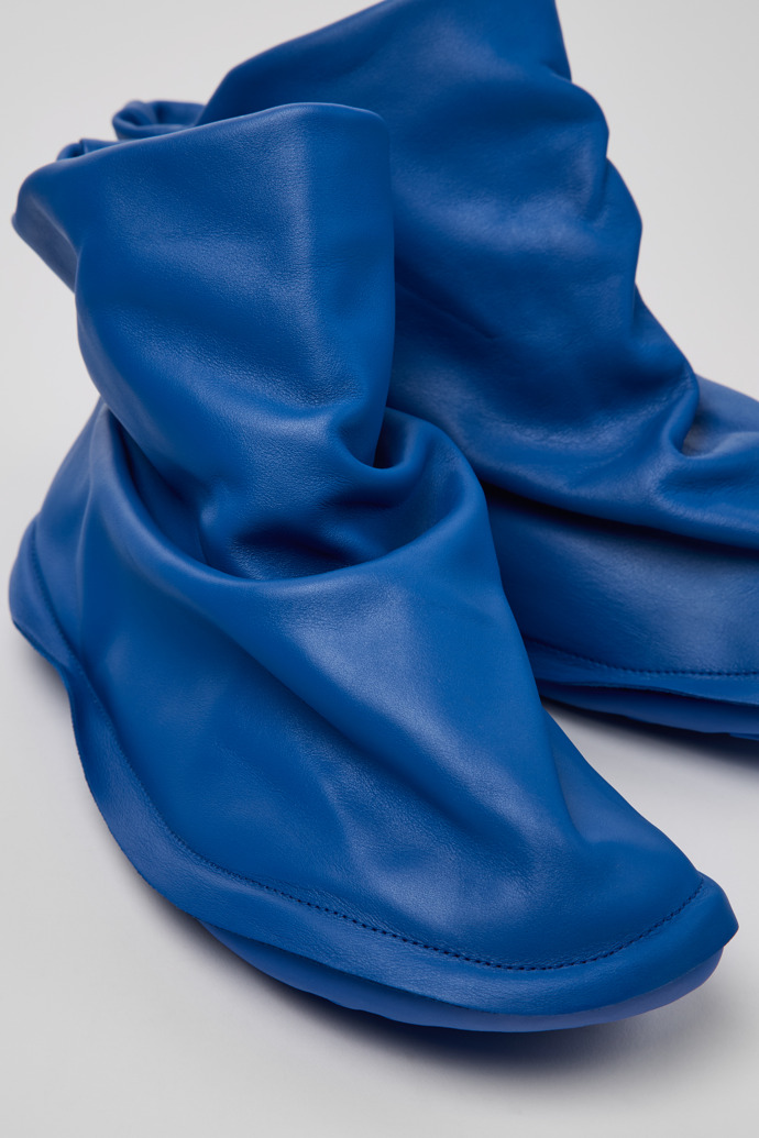 Close-up view of Camper x ISSEY MIYAKE - Peu Form Blue Leather Ankle Boots for Men.