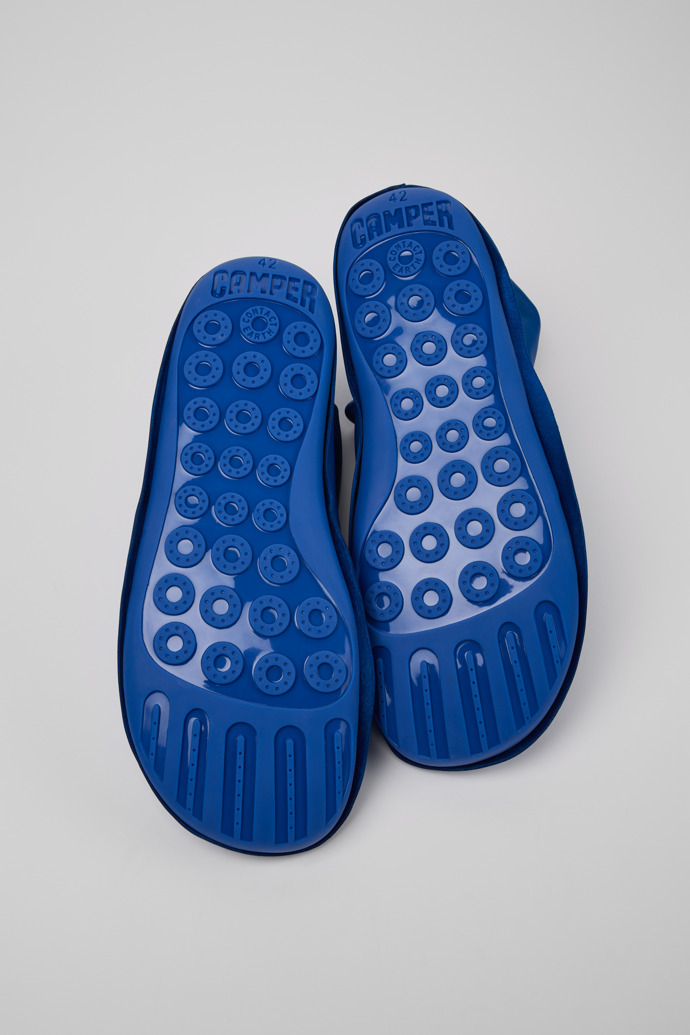 The soles of Camper x ISSEY MIYAKE - Peu Form Blue Leather Ankle Boots for Men.