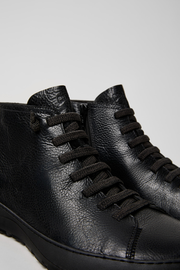 Close-up view of Peu Serra Black Regenerative Leather and Textile Ankle Boots for Men.