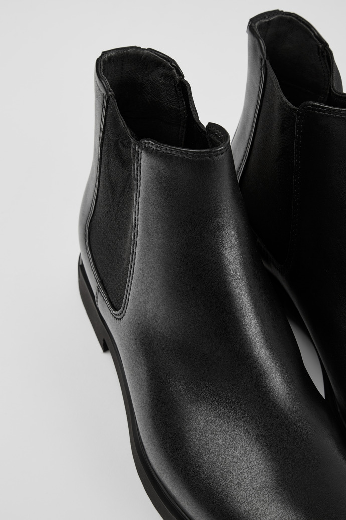 Close-up view of Iman Women's black ankle boot
