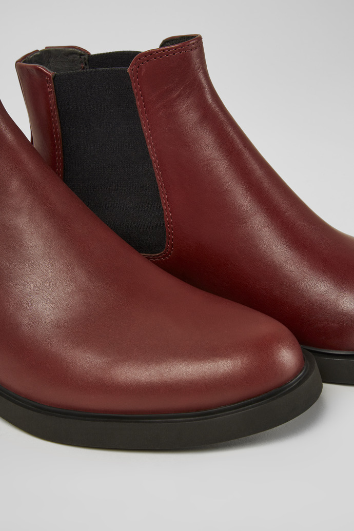 Close-up view of Iman Burgundy leather ankle boots