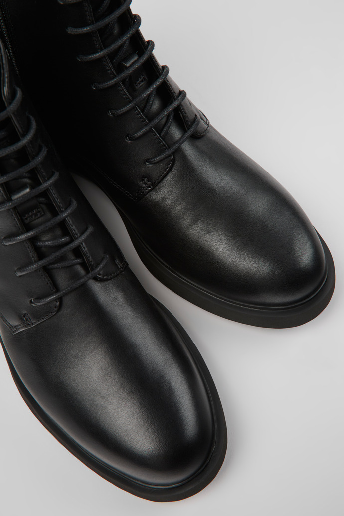 Close-up view of Iman Black leather lace-up boots for women