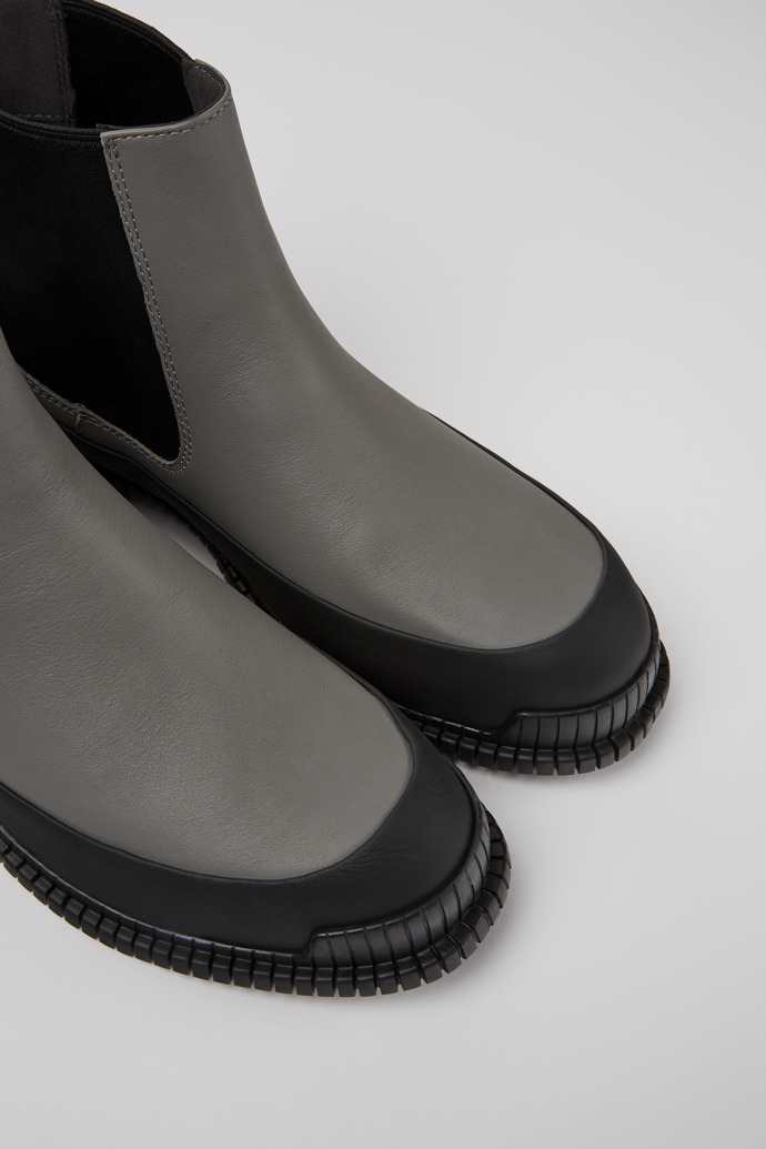 Close-up view of Pix Gray and black leather Chelsea boots for women