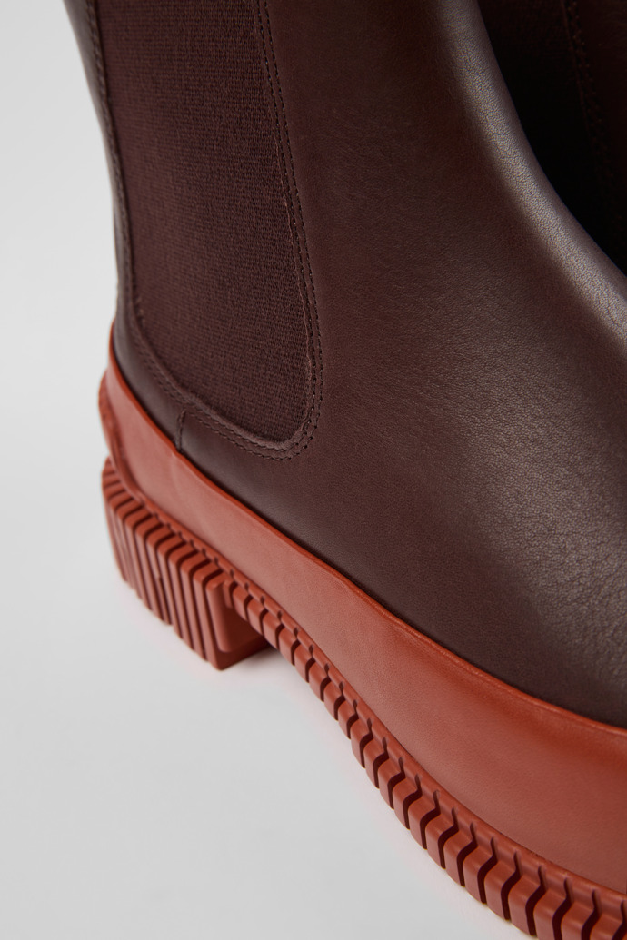 Close-up view of Pix Red and brown leather Chelsea boots for women