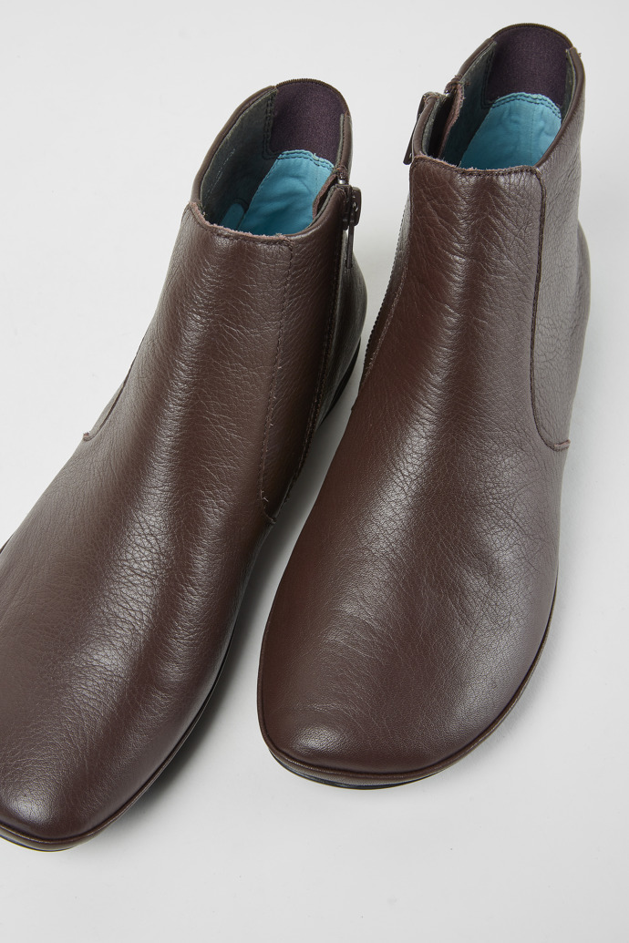 Close-up view of Right Dark brown leather ankle boots