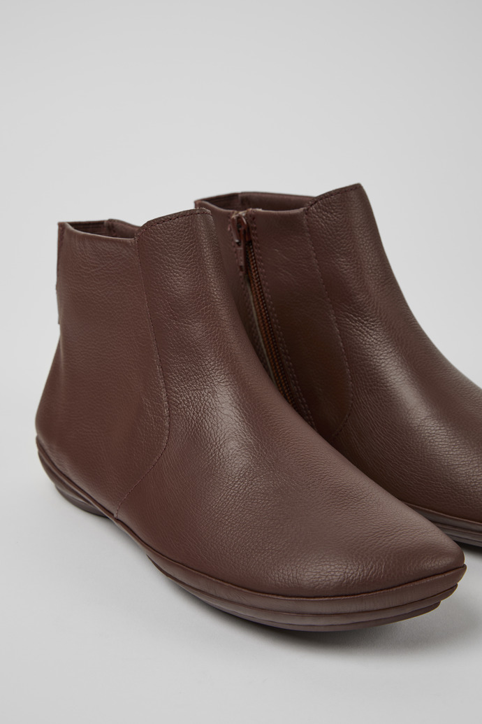 Close-up view of Right Brown leather ankle boots for women