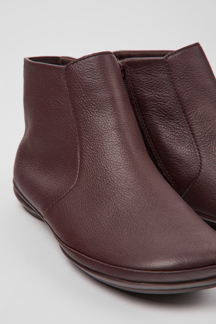 Close-up view of Right Burgundy leather ankle boots for women