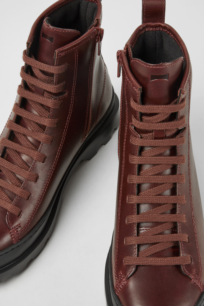 Close-up view of Brutus Burgundy leather lace-up boots