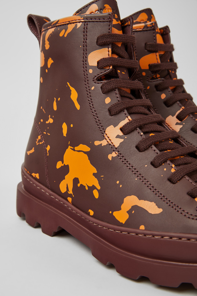 Close-up view of Brutus Burgundy and orange printed leather ankle boots for women