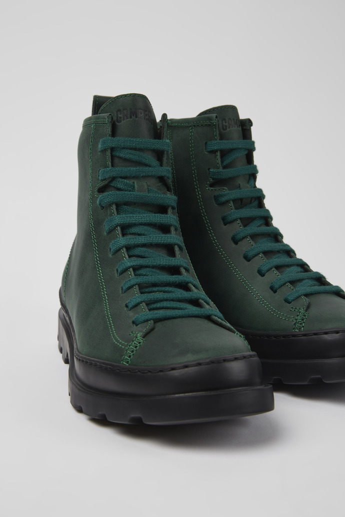 Close-up view of Brutus Green nubuck lace-up boots for women