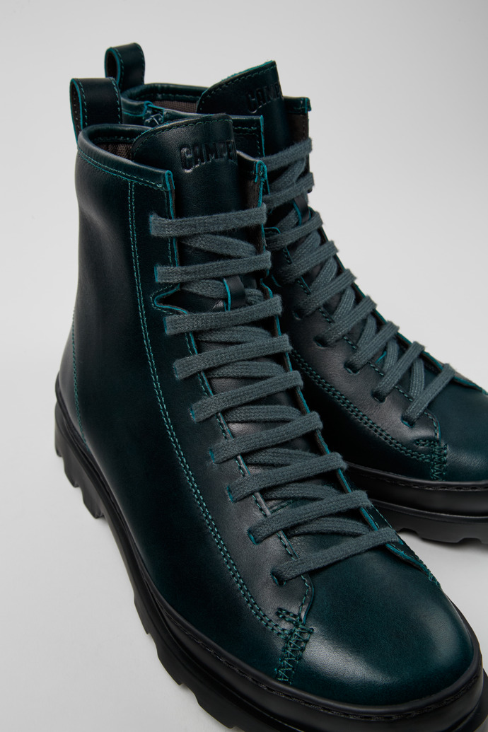 Close-up view of Brutus Green leather boots for women