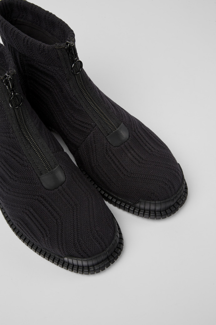 Close-up view of Pix Black zip boots for women
