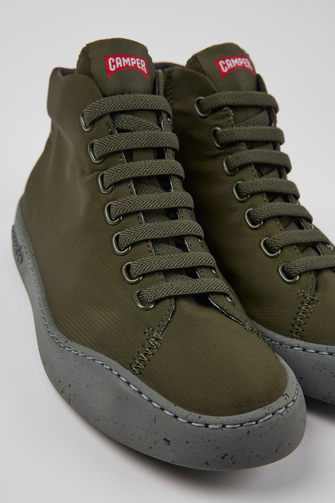 Close-up view of Peu Touring Green textile ankle boots for women