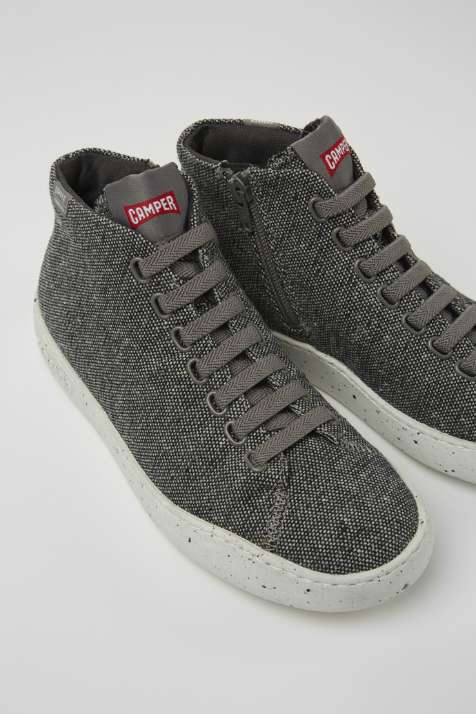Close-up view of Peu Touring Gray and black recycled wool sneakers for women