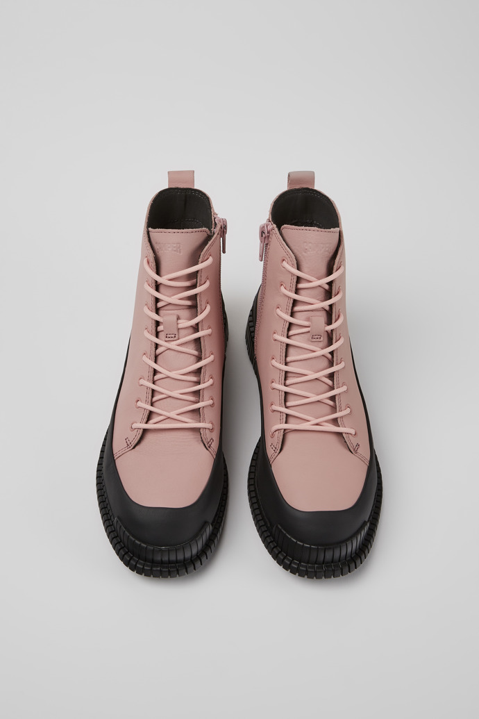 Overhead view of Pix Pink and black leather lace-up boots for women