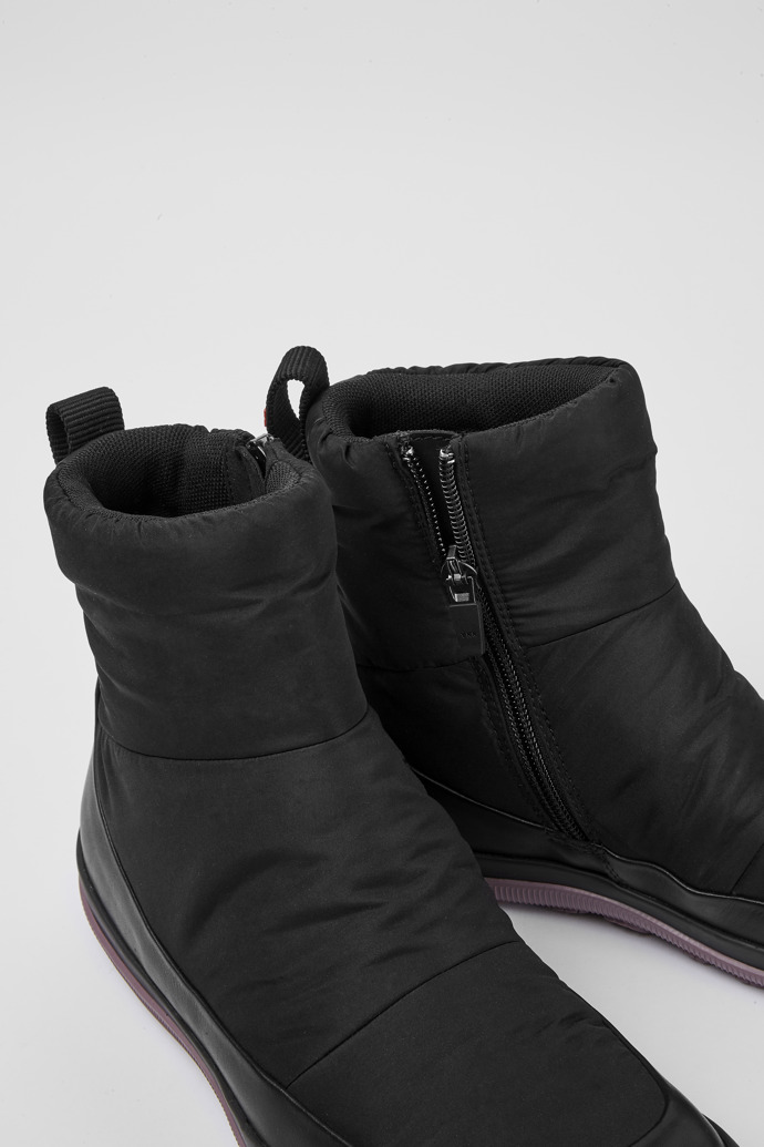Close-up view of Peu Pista Black leather and polyester boots