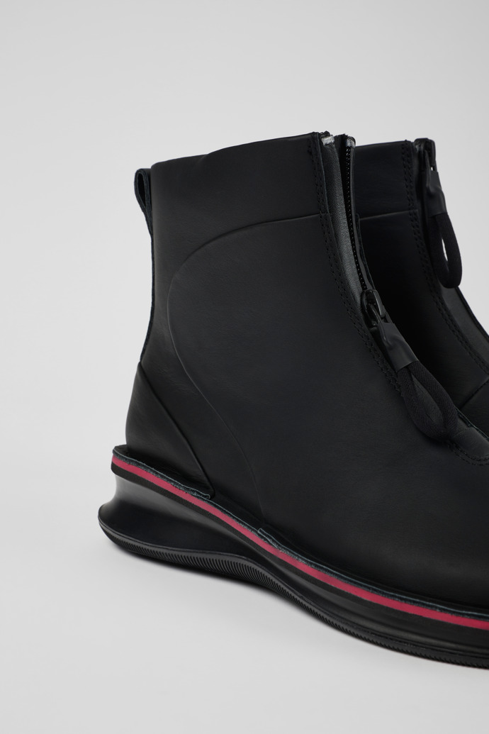 Close-up view of Rolling Black Boots for Women