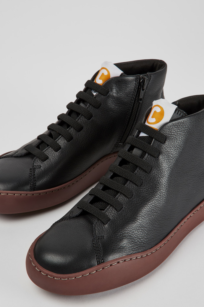 Close-up view of Peu Touring Black leather women's sneakers