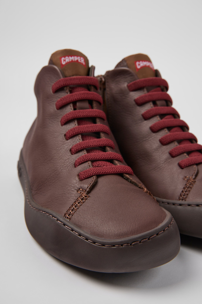 Close-up view of Peu Touring Brown leather sneakers for women