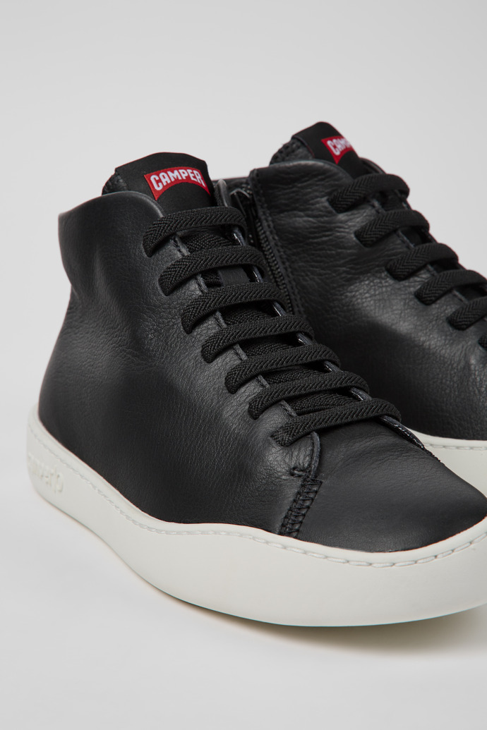 Close-up view of Peu Touring Black leather sneakers for women