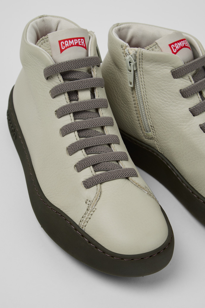 Close-up view of Peu Touring Gray Leather Sneaker Booties for Women.
