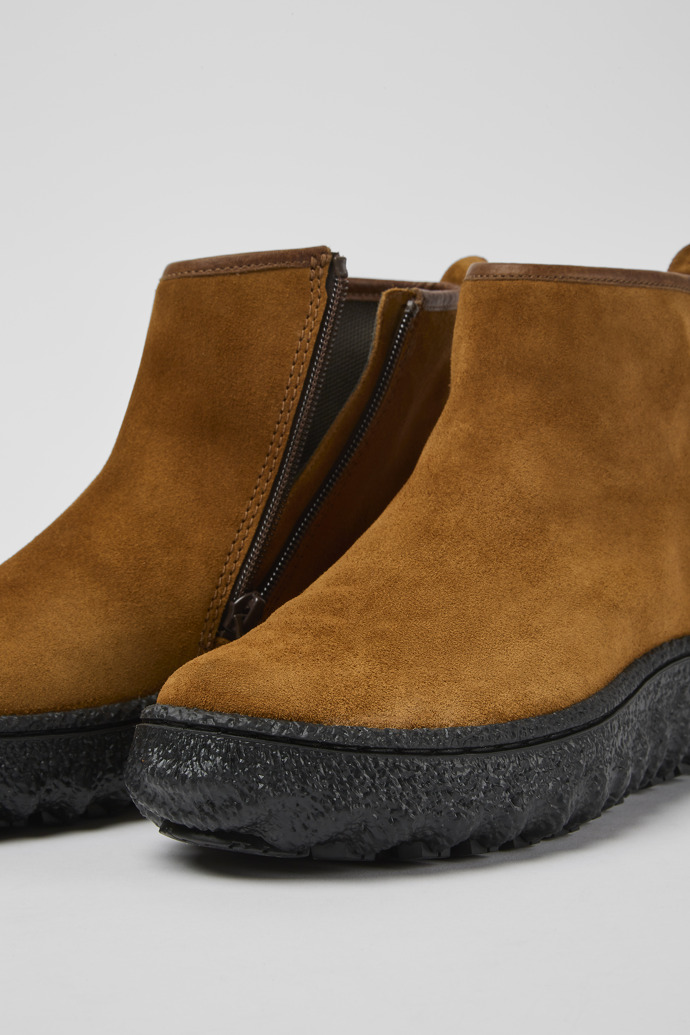 Close-up view of Ground Brown suede ankle boots