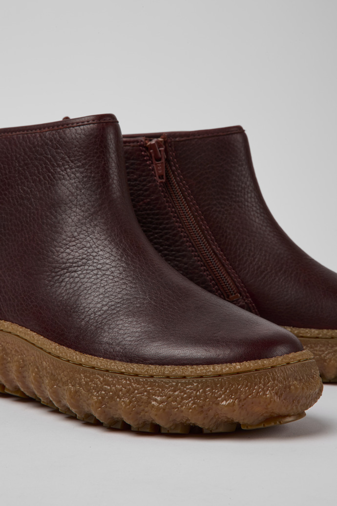 Close-up view of Ground Burgundy leather ankle boots